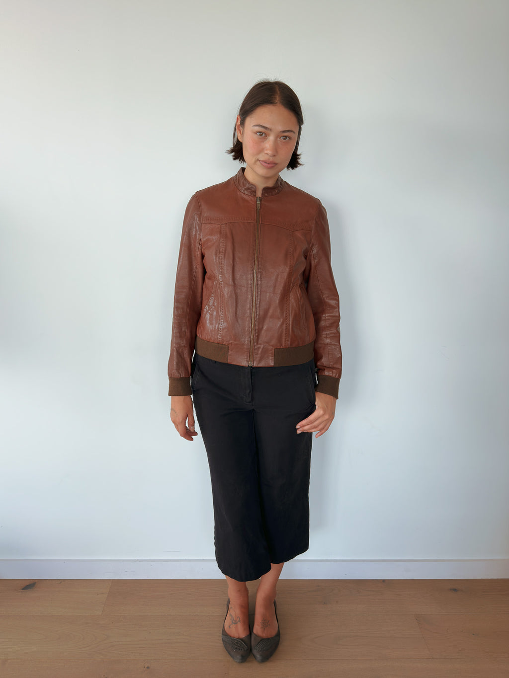 brown leather bomber jacket — size S