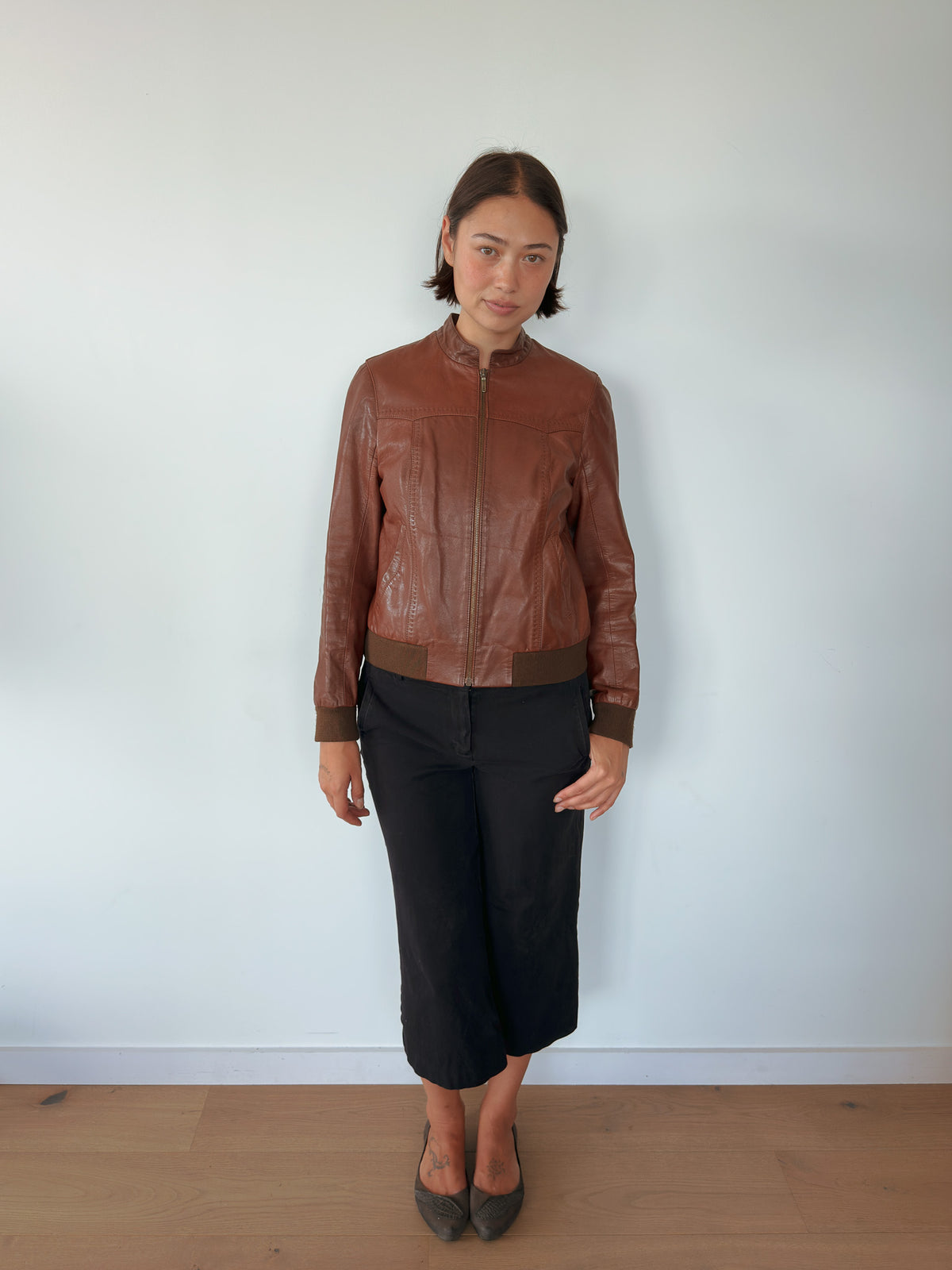 brown leather bomber jacket — size S