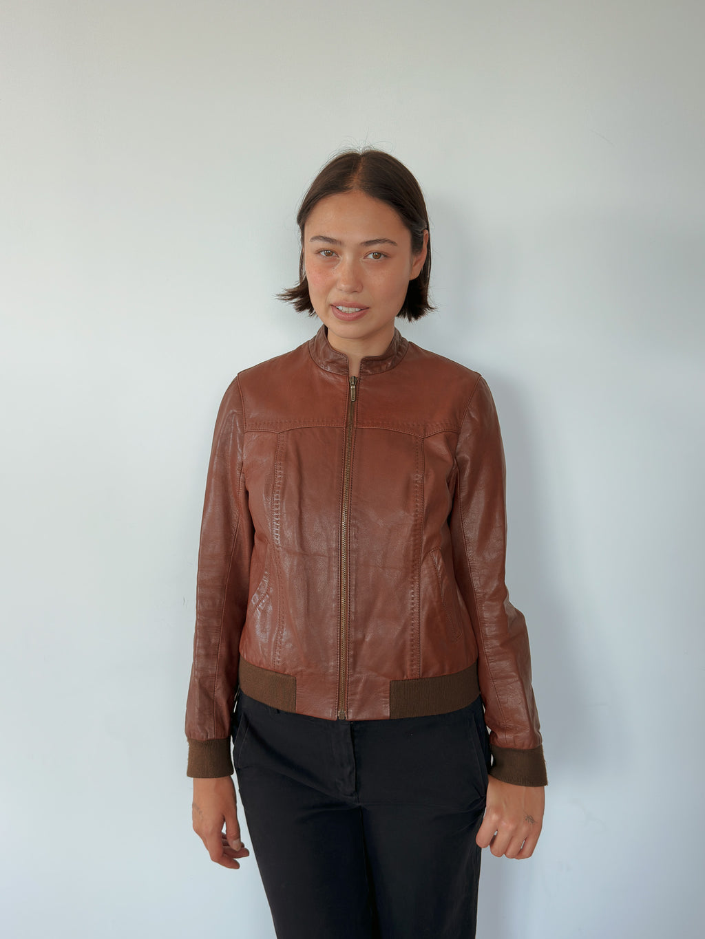 brown leather bomber jacket — size S