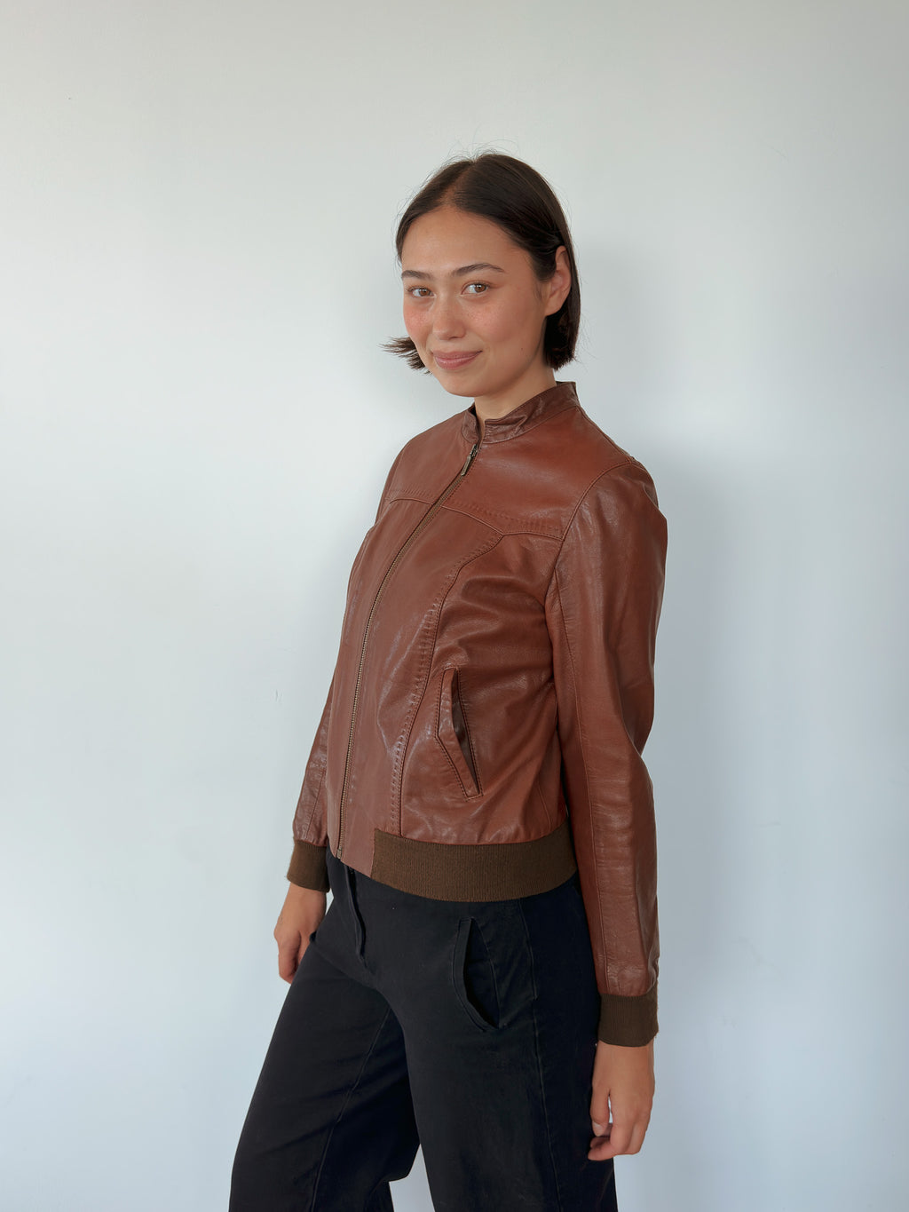 brown leather bomber jacket — size S