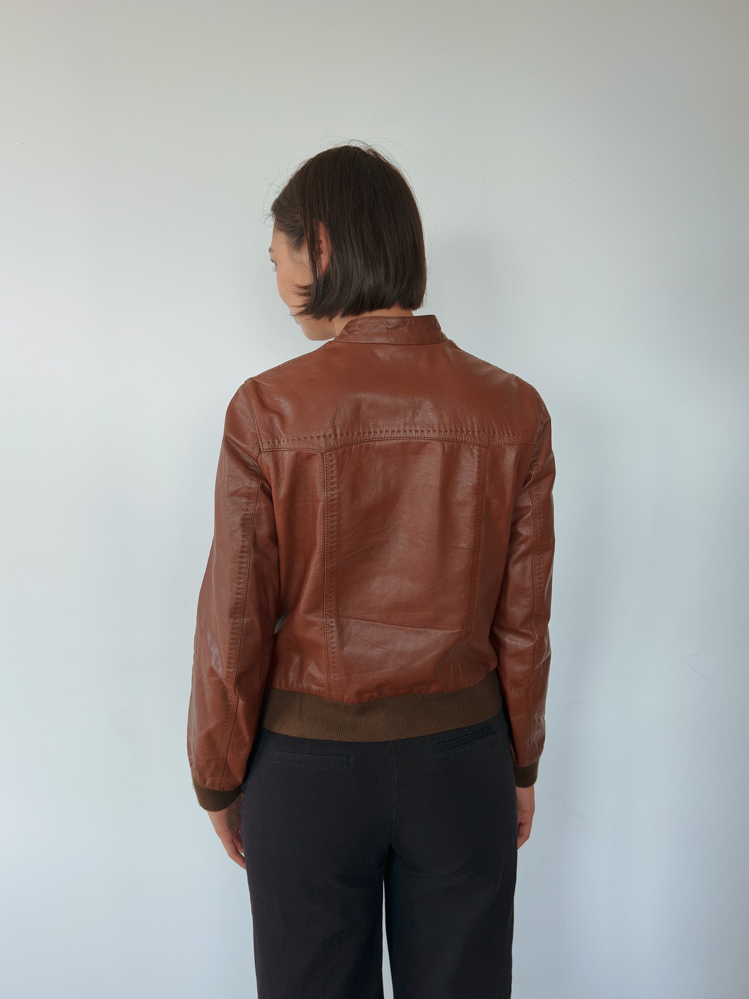 brown leather bomber jacket — size S
