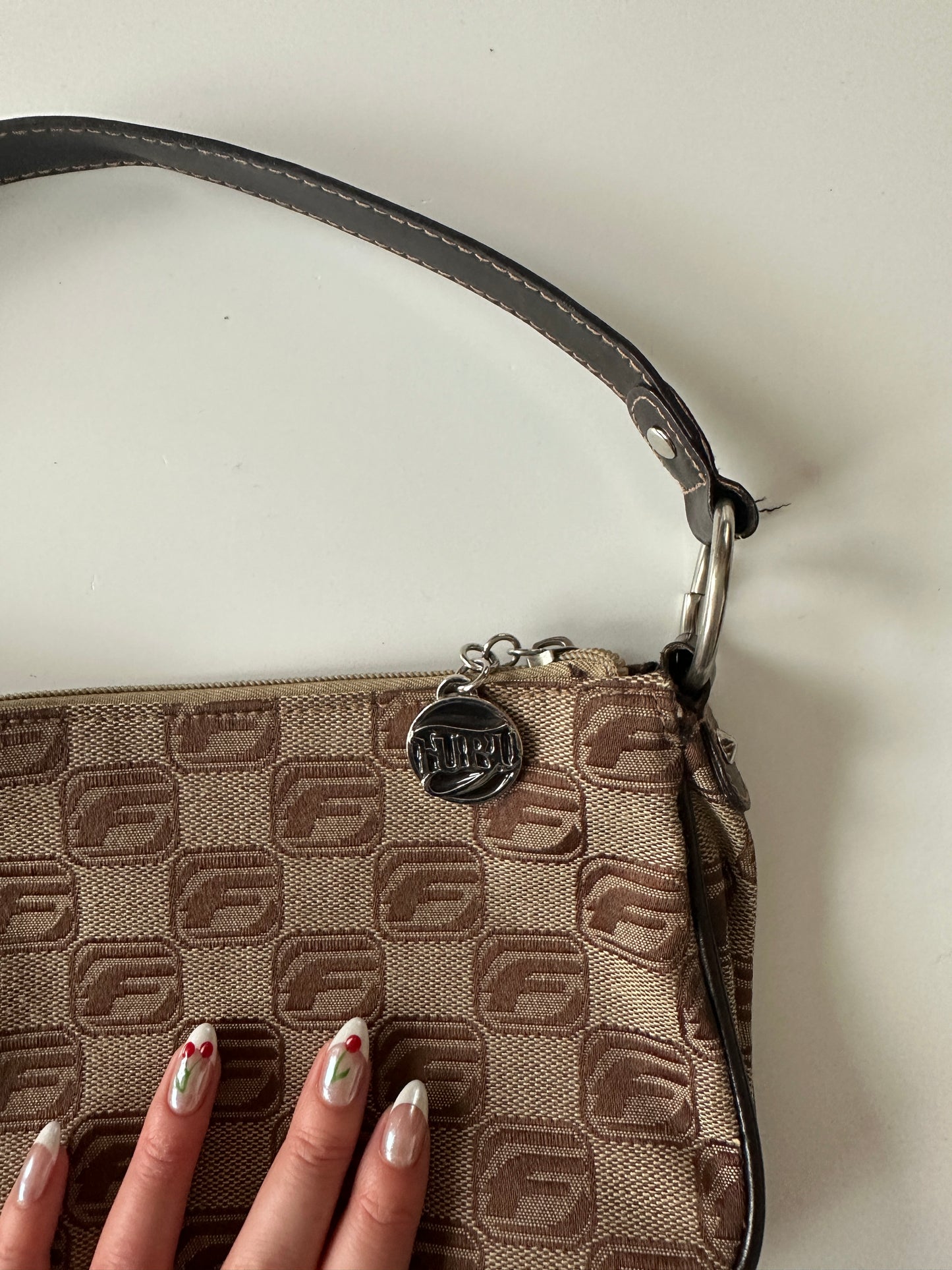 FUBU MONOGRAM BAGUETTE BAG ◦